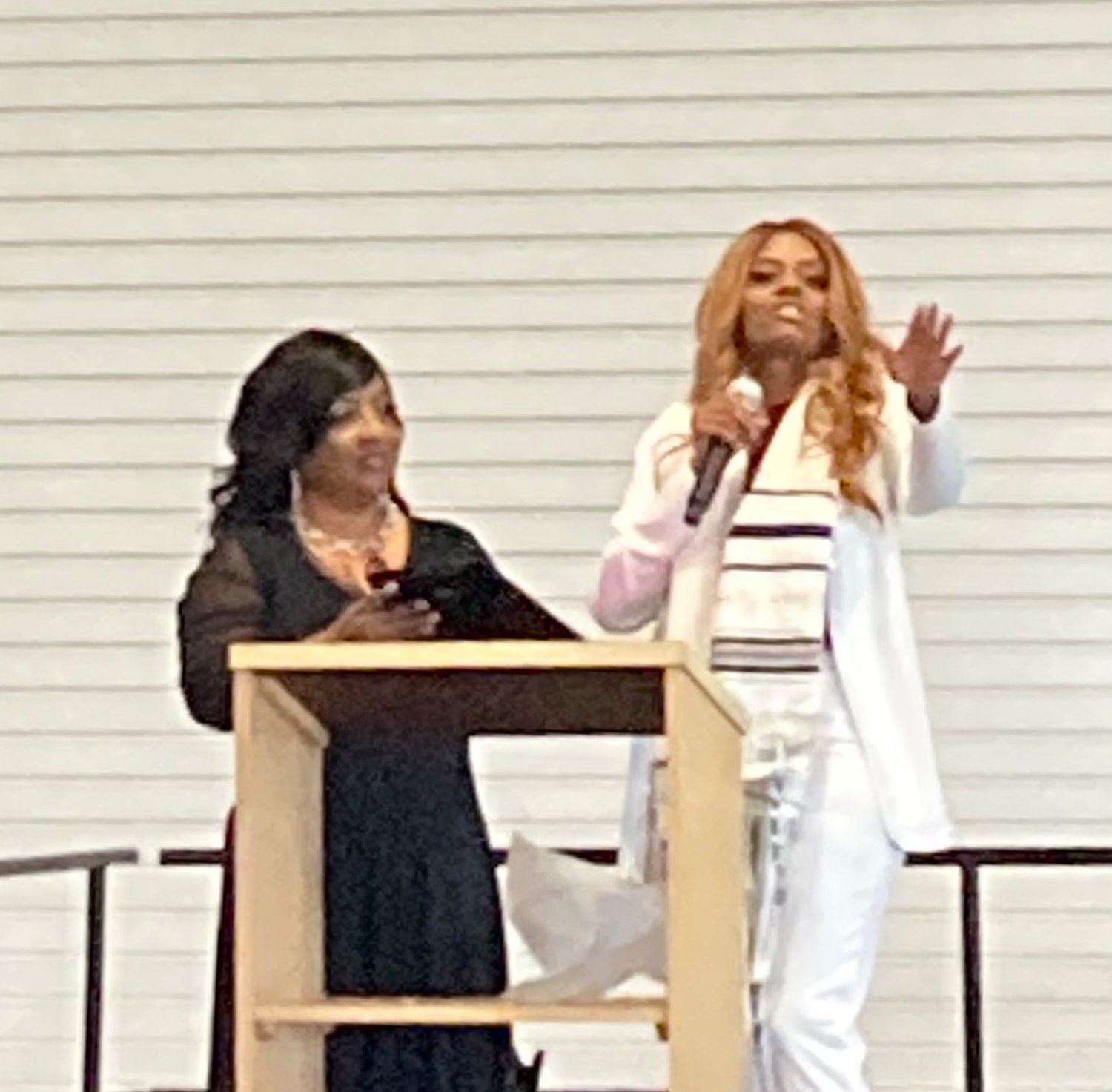 Pastor Cassandra Scott accepts award from Gonzales Pastor Neva Ford Nation at the Women Rise Up conference on Nov. 13.